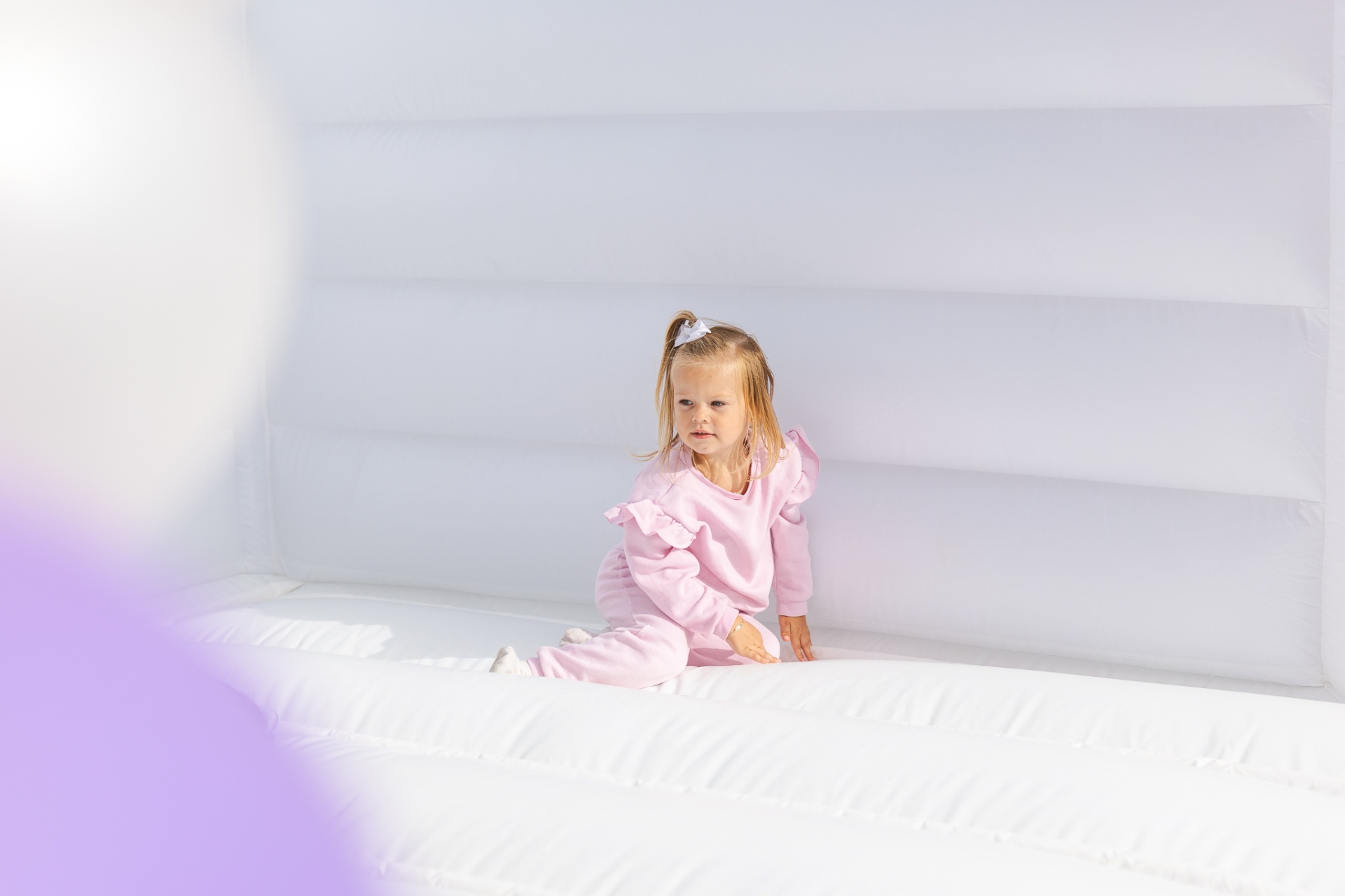 Young girl enjoying SolisaPlay's bubble house attraction